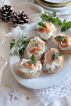 Christmas appetizer, smoked salmon and cream cheese canapés.