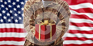 Christmas in the army. Christmas ball and gift box on an American military uniform