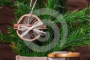 Christmas arrangement of dry orange slices and cinnamon sticks on the Christmas tree