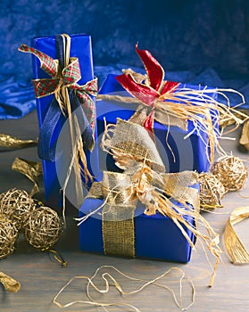 Christmas Ornaments. Three blue gift boxes.