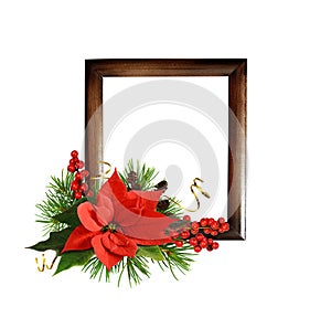 Christmas arrangement with red poinsettia flower and brown wooden frame isolated on white