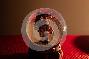 The Christmas atmosphere of a glass ball with a reindeer inside