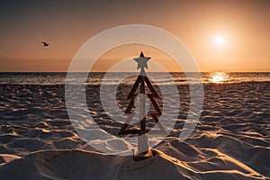 Christmas in Australia is held in the summer months and is usually spent outdoors or by the beach. A wooden Christmas tree stands