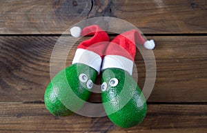 Christmas avocado couple. avocado in christmas hat