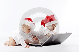 Christmas babies with laptop