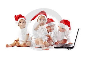 Christmas babies with laptop