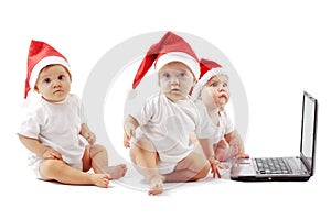 Christmas babies with laptop