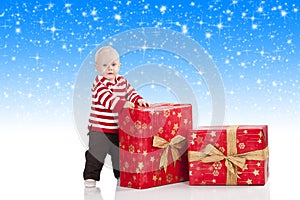 Christmas baby boy with gift box,