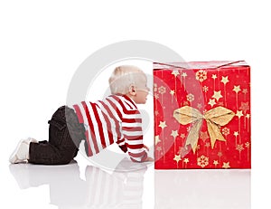 Christmas baby boy with gift box,