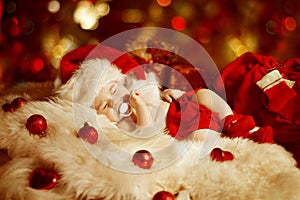 Christmas Baby, New Born Kid Sleeping As Xmas Gift In Santa Hat