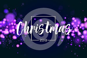 Christmas background 2019 with blue magic bokeh sparkle glitter lights. Abstract defocused circular New Year background