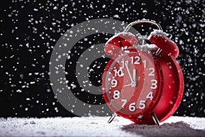 Christmas background of Alarm Clock And Snow, New Year`s Eve
