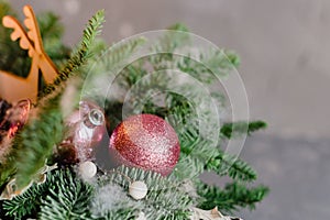 Christmas background - baubles and branch of spruce tree