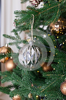 Christmas background - baubles and branch of spruce tree.