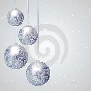 Christmas background with baubles on ribbons.