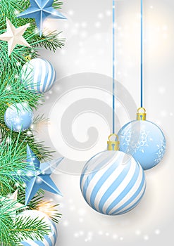 Christmas background with blue ornaments and branches