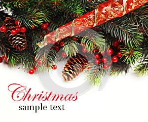 Christmas background. Christmas boarder with fir tree branch with cones and ornament. Christmas baubles in golden and red colour.