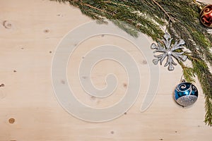 Christmas background. Christmas branch of spruce on a wooden background