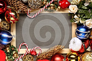 Christmas background: Christmas decoration around a blank chalk blackboard with copy space for your text