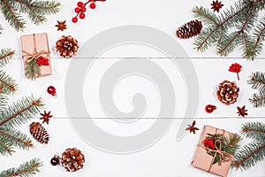 Christmas background with Christmas gift, fir branches, pine cones, snowflakes, red decorations. Xmas and Happy New Year