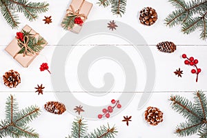 Christmas background with Christmas gift, fir branches, pine cones, snowflakes, red decorations. Xmas and Happy New Year