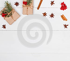 Christmas background with Christmas gift, fir branches, pine cones, snowflakes, red decorations. Xmas and Happy New Year compositi