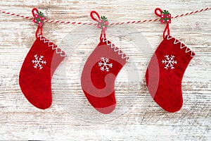 Christmas background. Christmas red socks on wooden background.