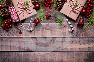 Christmas background concept. Top view of Christmas gift box red sock with spruce branches, pine cones, red berries