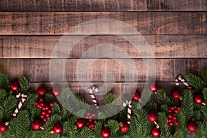 Christmas background concept. Top view of Christmas gift box red sock with spruce branches, pine cones, red berries