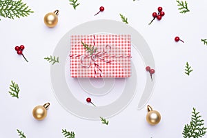 Christmas background concept. Top view of Christmas gift box red sock with spruce branches, pine cones, red berries