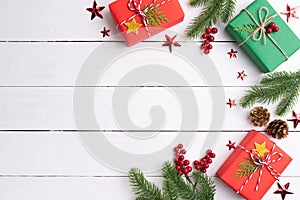 Christmas background concept. Top view of Christmas gift box red sock with spruce branches, pine cones, red berries