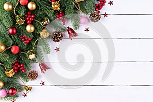 Christmas background concept. Top view of Christmas gift box red sock with spruce branches, pine cones, red berries