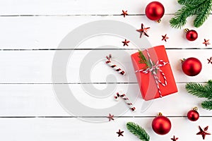 Christmas background concept. Top view of Christmas gift box red sock with spruce branches, pine cones, red berries