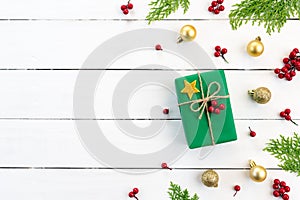 Christmas background concept. Top view of Christmas green and red gift box with spruce branches, pine cones