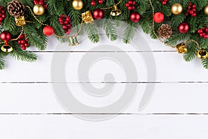 Christmas background concept. Top view of Christmas spruce branches, pine cones, red berries
