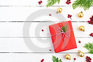 Christmas background concept. Top view of Christmas green and red gift box with spruce branches, pine cones