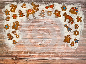 Christmas background with cookies on the old wooden board grunge