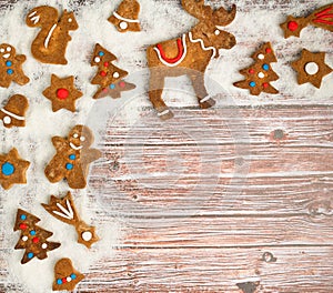 Christmas background with cookies on the old wooden board grunge