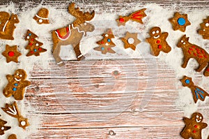 Christmas background with cookies on the old wooden board grunge