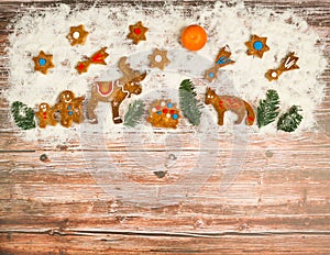 Christmas background with cookies on the old wooden board grunge