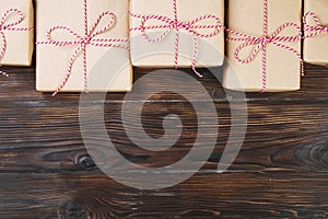 Christmas background with craft gift boxes on wooden background