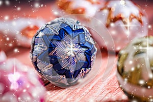 Christmas background, decoration. Christmas balls on a wooden table. Soft focus. Sparkles and bubbles. Abstract background.