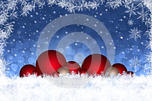 Christmas background decoration with red baubles in snow