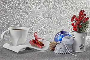 Christmas background with decorations, a cup with a saucer, a ca