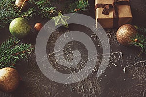 Christmas background with decorations and gift boxes on concrete table. Top view. Copy space.  Merry christmas and happy new year