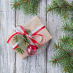 Christmas background with decorations and gift boxes on white wooden board