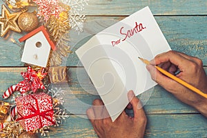 Christmas background with decorations with hand writting on greeting cards. Top view with copy space
