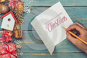 Christmas background with decorations with hand writting on greeting cards. Top view with copy space