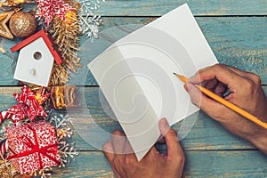 Christmas background with decorations with hand writting on greeting cards. Top view with copy space