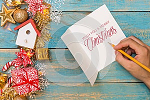 Christmas background with decorations with hand writting on greeting cards. Top view with copy space